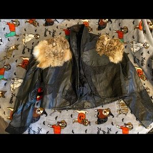 Leather jacket with fur on shoulders